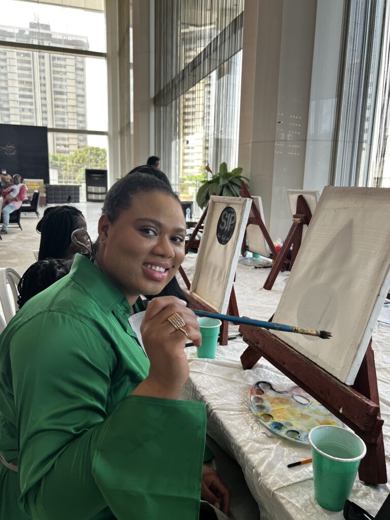 A woman at sip and paint