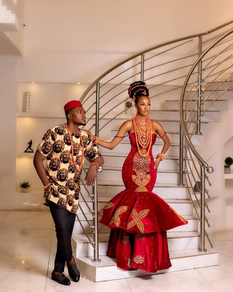 A traditional Igbo outfit for men, consisting of the Isiagu shirt, trousers, and the Okpu (red cap)/ Igbo female attire